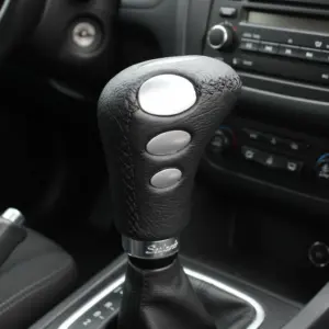 Perilla de cambio aluminio Cuero Negro   - NM50025333/FA210